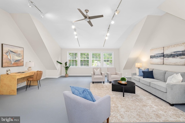 1517 Snughill Ct, Vienna, VA 22182 - living area with rail lighting, lofted ceiling, concrete floors, baseboards, and a ceiling fan