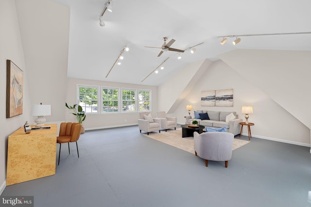 1517 Snughill Ct, Vienna, VA 22182 - living room featuring rail lighting, ceiling fan, vaulted ceiling, baseboards, and concrete flooring