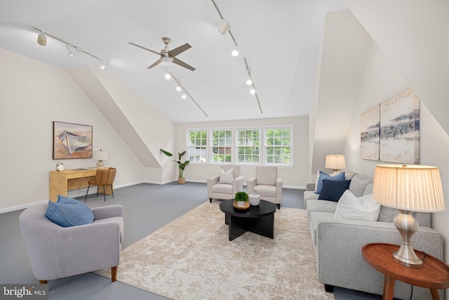 1517 Snughill Ct, Vienna, VA 22182 - living area featuring track lighting, ceiling fan, finished concrete floors, baseboards, and vaulted ceiling