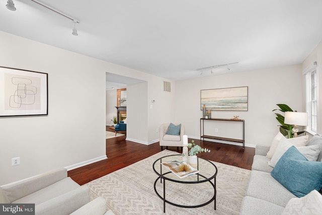 1517 Snughill Ct, Vienna, VA 22182 - living room featuring track lighting, wood finished floors, and baseboards