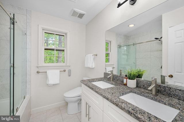 1517 Snughill Ct, Vienna, VA 22182 - bathroom with tiled shower, toilet, double vanity, baseboards, and tile patterned floors