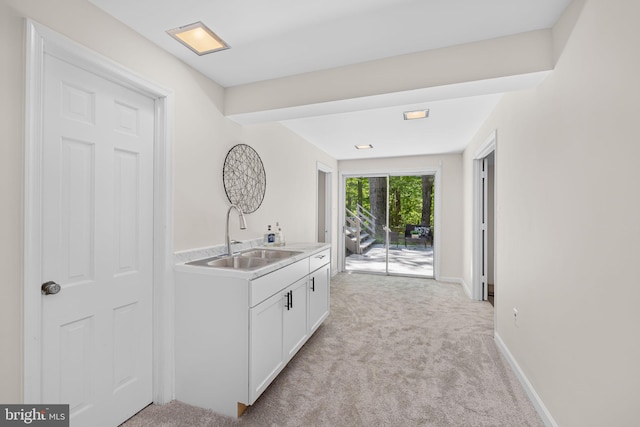 1517 Snughill Ct, Vienna, VA 22182 - bar area featuring a sink, light colored carpet, and baseboards