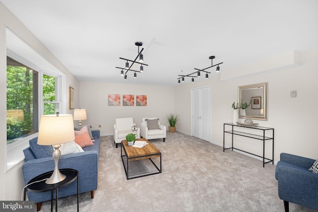 1517 Snughill Ct, Vienna, VA 22182 - carpeted living room with track lighting, a chandelier, and baseboards