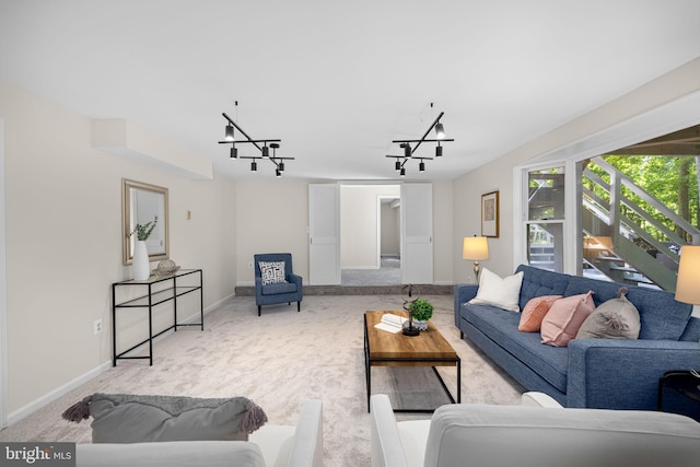 1517 Snughill Ct, Vienna, VA 22182 - living room with carpet flooring, baseboards, rail lighting, and a chandelier