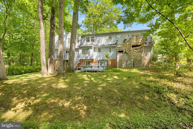 1517 Snughill Ct, Vienna, VA 22182 - back of house with stairway, a wooden deck, and a yard