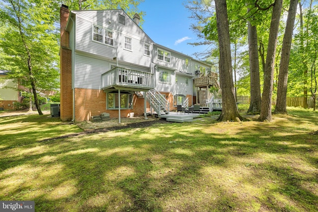 1517 Snughill Ct, Vienna, VA 22182 - back of property featuring a chimney, a deck, stairway, brick siding, and cooling unit