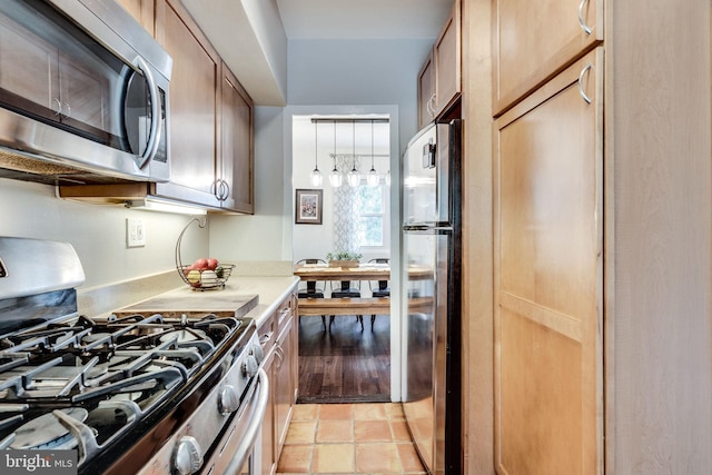 1608 Preston Rd, Alexandria, VA 22302 - kitchen featuring pendant lighting, stainless steel appliances, and light countertops