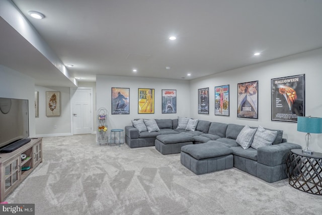 living area with carpet and recessed lighting