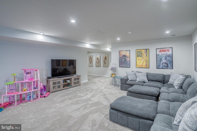 carpeted living room with recessed lighting and baseboards