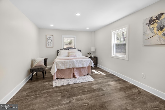 bedroom with baseboards, dark wood-style flooring, and recessed lighting