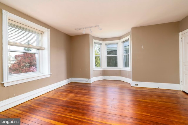 610 Washington Ln, Jenkintown, PA 19046 - empty room featuring hardwood / wood-style flooring, baseboards, and a wealth of natural light