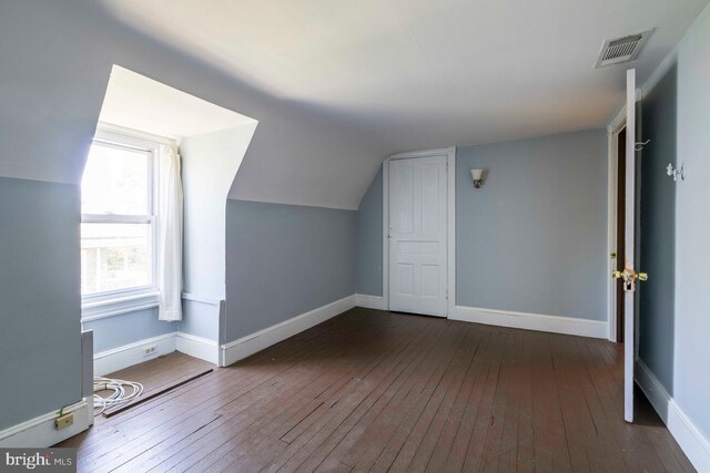610 Washington Ln, Jenkintown, PA 19046 - additional living space with hardwood / wood-style floors, visible vents, lofted ceiling, and baseboards