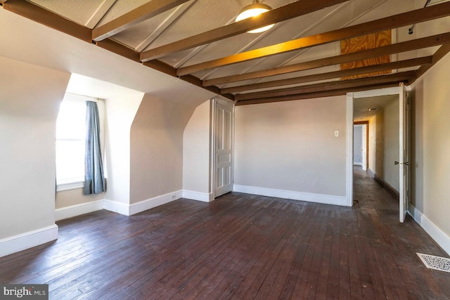 610 Washington Ln, Jenkintown, PA 19046 - bonus room with dark wood finished floors, baseboards, vaulted ceiling with beams, and visible vents