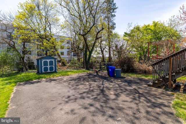 610 Washington Ln, Jenkintown, PA 19046 - view of patio with a storage shed, an outbuilding, and stairway