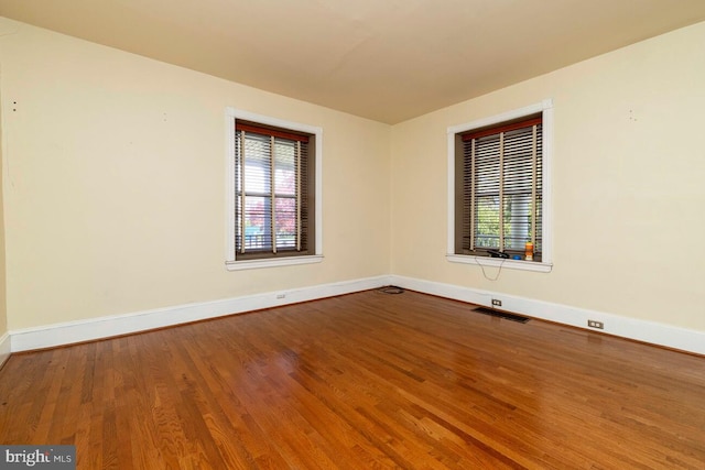 610 Washington Ln, Jenkintown, PA 19046 - spare room with visible vents, wood finished floors, and baseboards