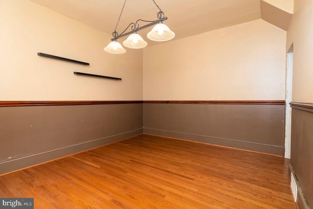 610 Washington Ln, Jenkintown, PA 19046 - unfurnished room featuring visible vents, baseboards, vaulted ceiling, and wood finished floors