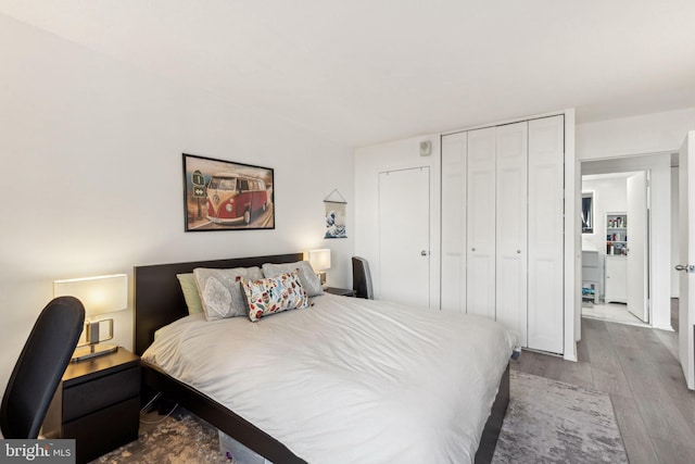 bedroom with a closet and hardwood / wood-style floors