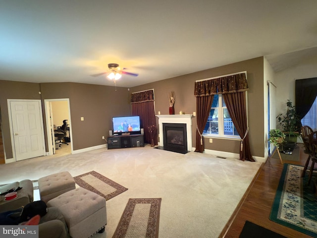 11258 Wildmeadows St, Waldorf, MD 20601 - living area featuring baseboards, ceiling fan, a fireplace with flush hearth, and wood finished floors