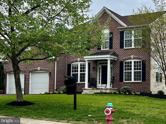 view of front facade featuring a front yard and brick siding