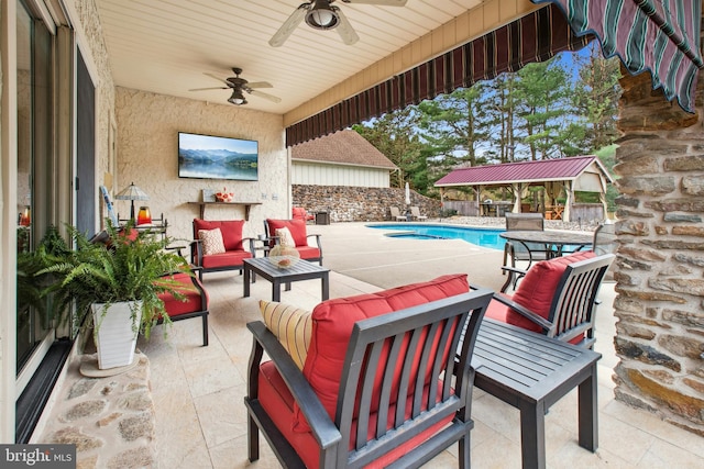 view of patio / terrace featuring a fenced backyard, ceiling fan, a fenced in pool, and outdoor lounge area