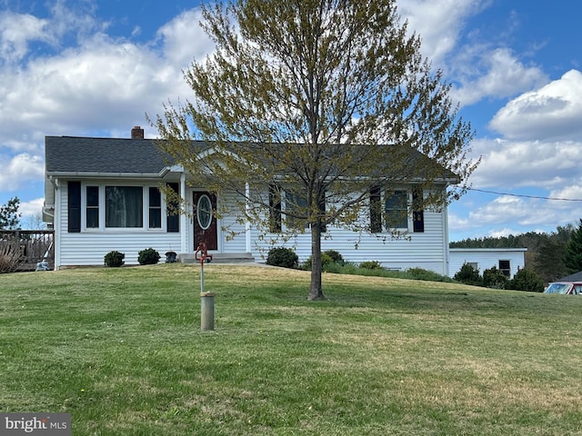 ranch-style home with a chimney and a front lawn