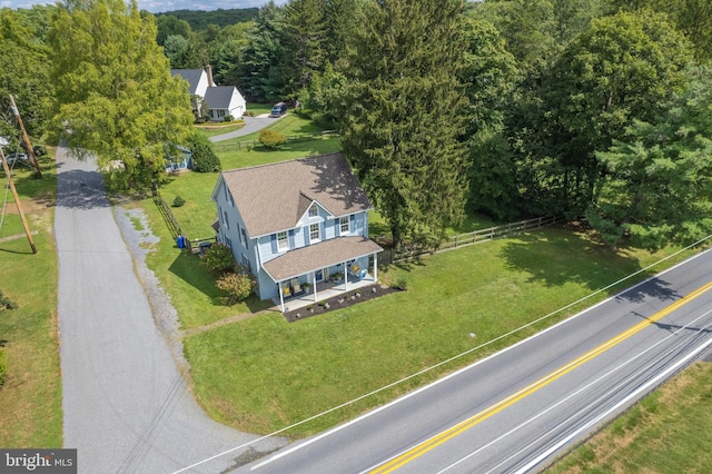 bird's eye view featuring a wooded view