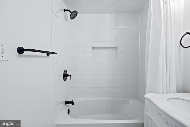 bathroom featuring a sink and shower / bath combo