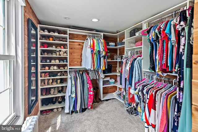 spacious closet with carpet flooring and radiator heating unit