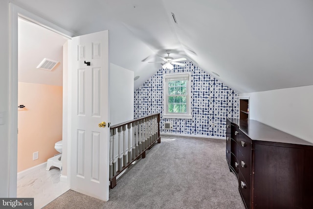 bonus room with ceiling fan, carpet floors, baseboards, lofted ceiling, and visible vents