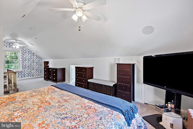 carpeted bedroom featuring ceiling fan, baseboards, and lofted ceiling