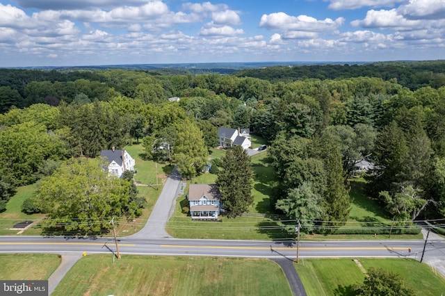bird's eye view featuring a forest view