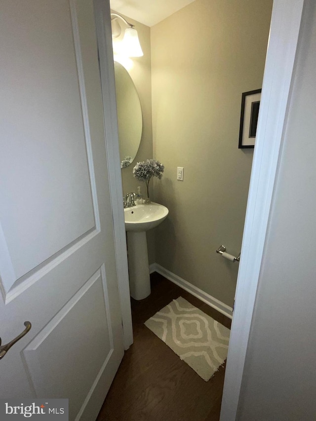 7805 Wistar Woods Pl, Henrico, VA 23228 - bathroom featuring a sink, wood finished floors, and baseboards