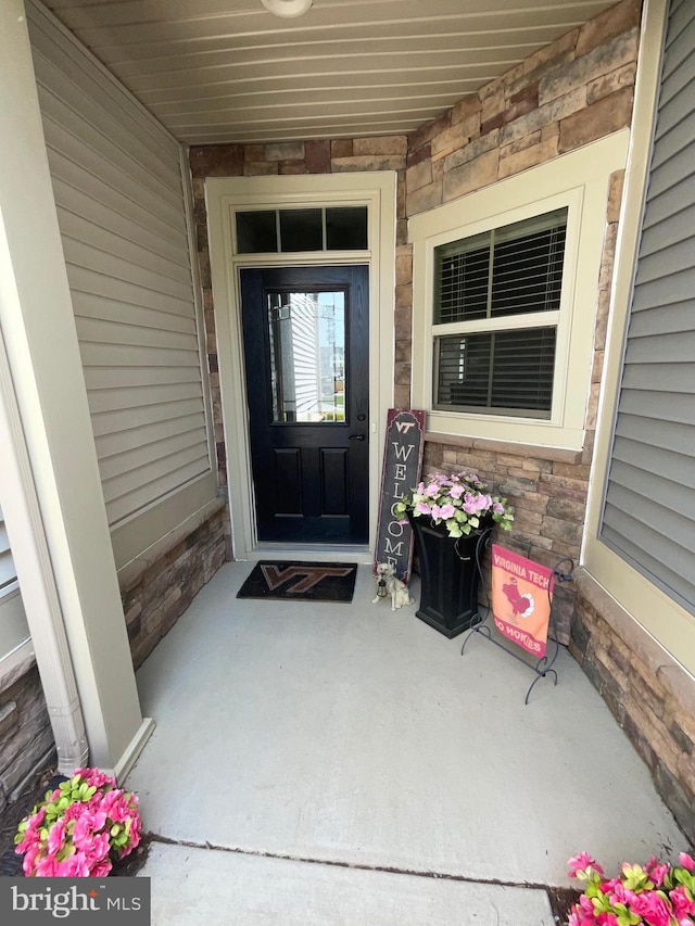 7805 Wistar Woods Pl, Henrico, VA 23228 - entrance to property featuring stone siding and covered porch
