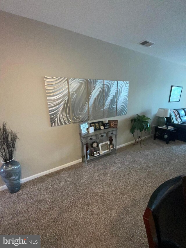 7805 Wistar Woods Pl, Henrico, VA 23228 - living area featuring visible vents, carpet, and baseboards