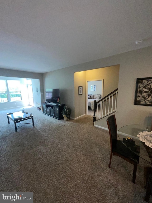 7805 Wistar Woods Pl, Henrico, VA 23228 - living room with stairs, carpet floors, and baseboards