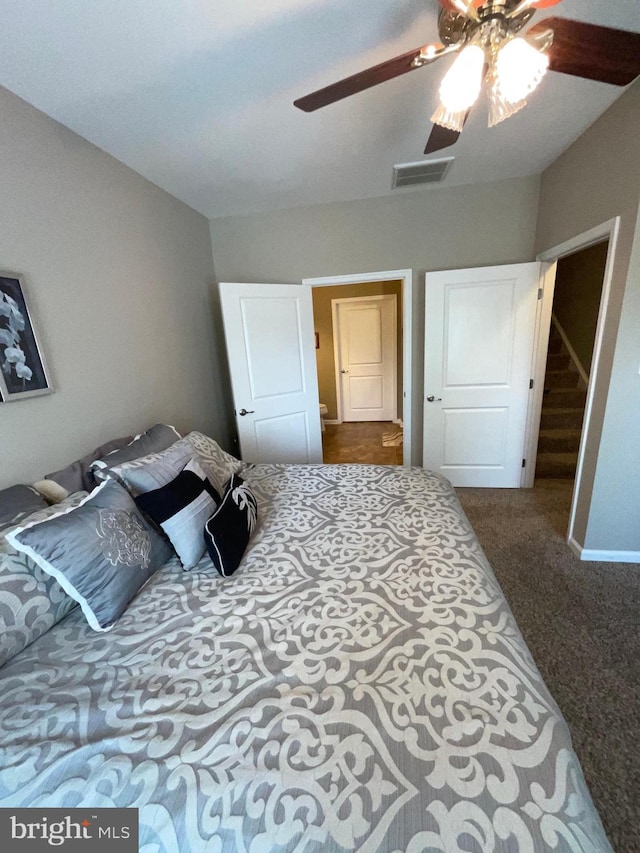 7805 Wistar Woods Pl, Henrico, VA 23228 - bedroom with dark colored carpet, visible vents, and ceiling fan