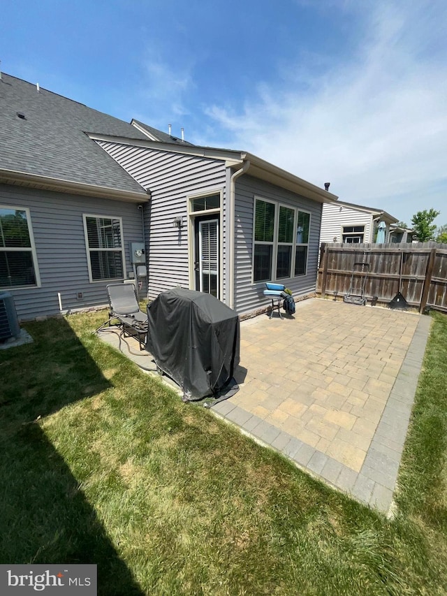 7805 Wistar Woods Pl, Henrico, VA 23228 - back of property featuring fence, a yard, a patio, and central AC