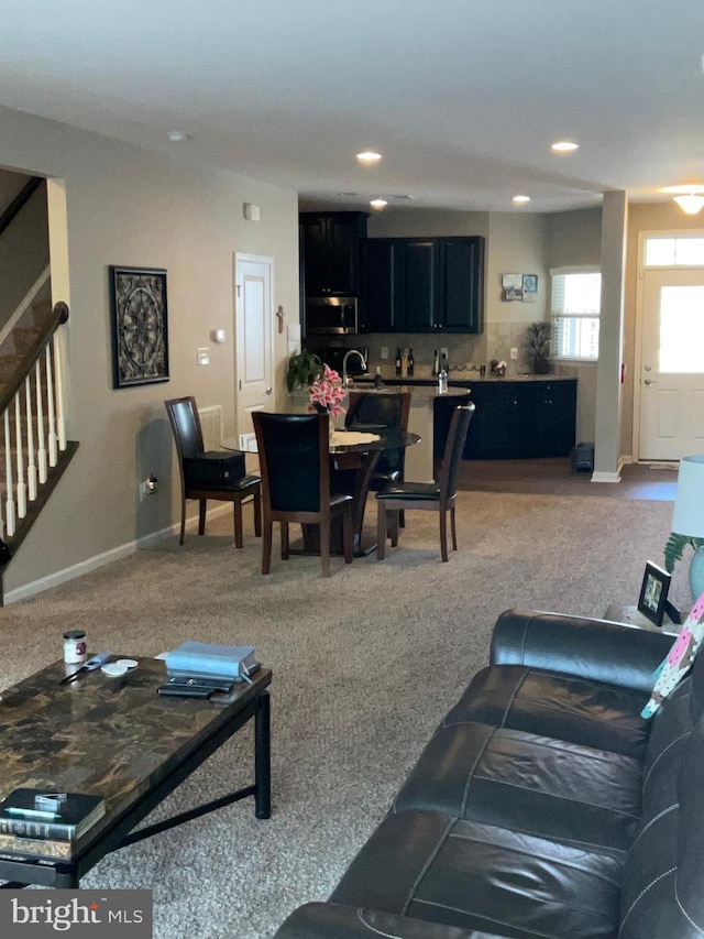 7805 Wistar Woods Pl, Henrico, VA 23228 - carpeted living area with baseboards, recessed lighting, and stairs