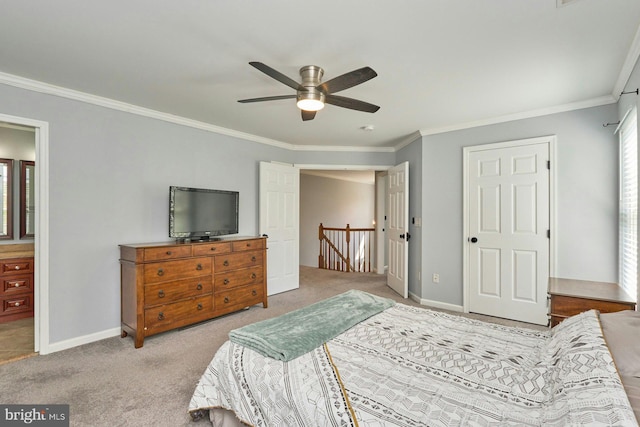 carpeted bedroom featuring crown molding, baseboards, and a ceiling fan