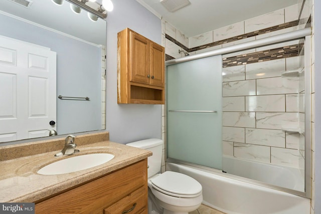 bathroom with visible vents, ornamental molding, vanity, toilet, and enclosed tub / shower combo