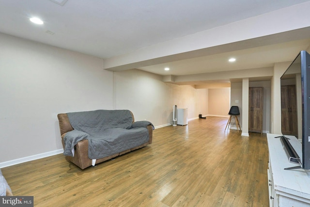 sitting room featuring recessed lighting, baseboards, and wood finished floors