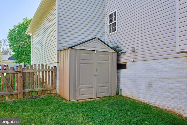 view of shed with fence