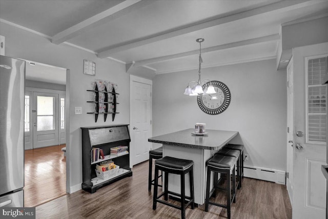 dining area featuring an inviting chandelier, beamed ceiling, baseboard heating, and dark wood-type flooring