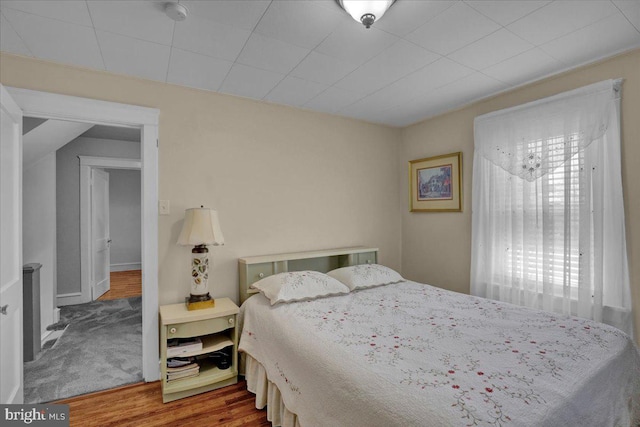 bedroom featuring wood finished floors