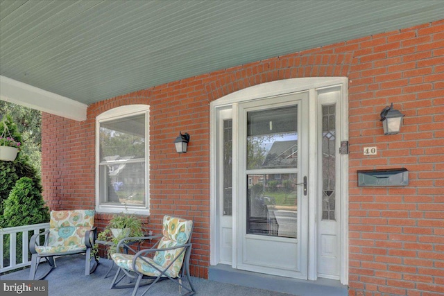property entrance with brick siding