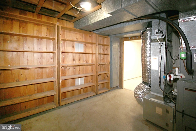 unfinished below grade area featuring heating unit