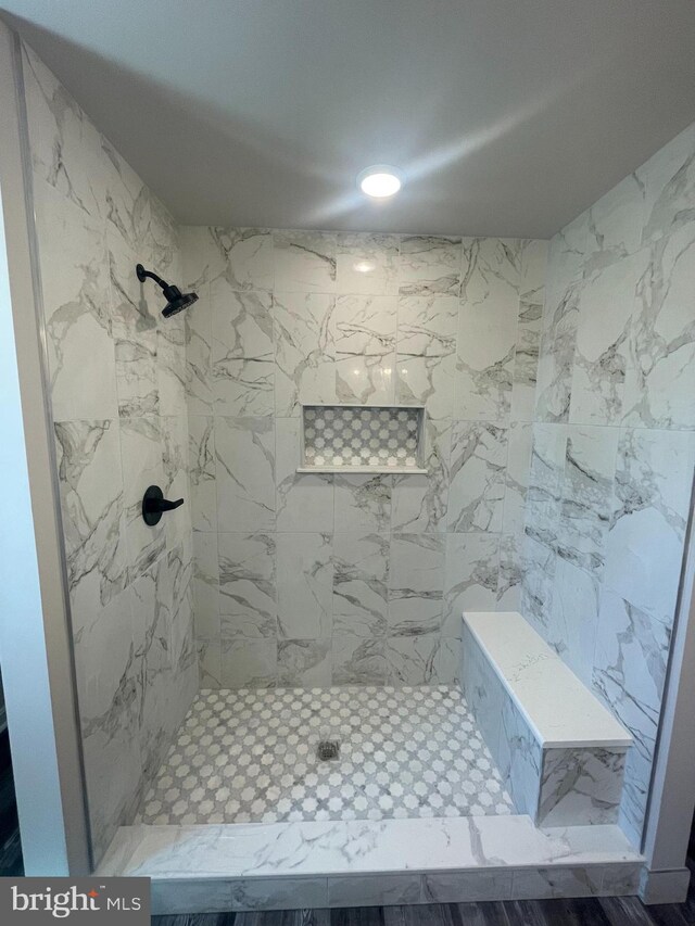 bathroom featuring tiled shower