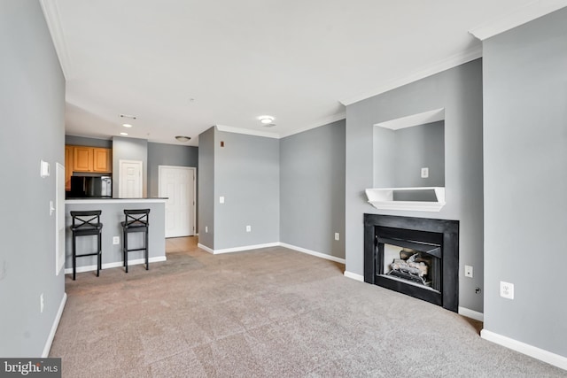 unfurnished living room featuring light colored carpet, baseboards, and a fireplace