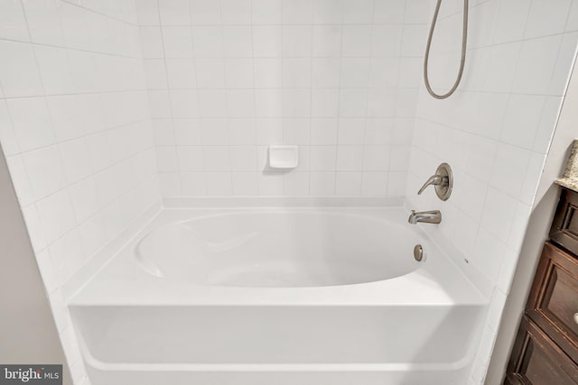 full bath featuring washtub / shower combination and vanity