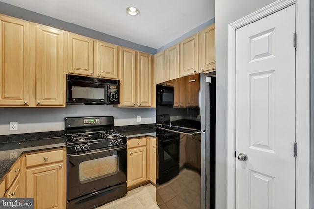 kitchen featuring light brown cabinets and black appliances